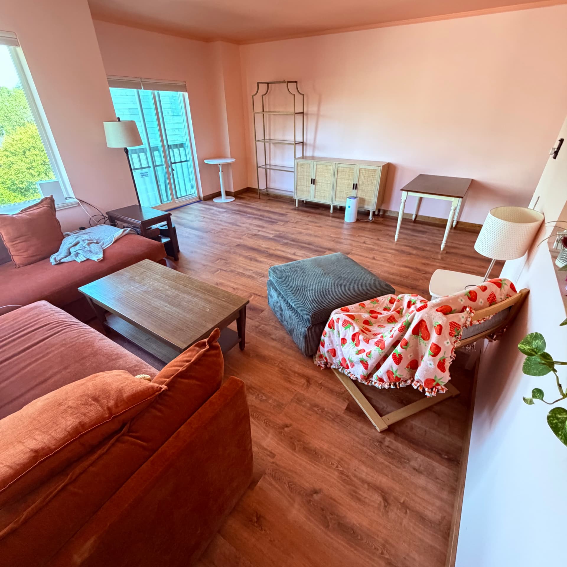 Living room before and after new plank flooring — after
